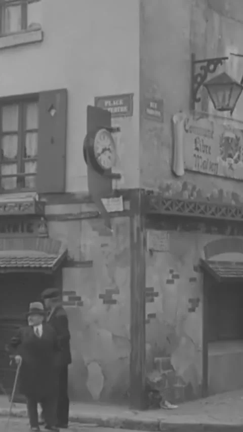 PARIS - 1930s - People patronize sidewalk cafes and men work as painters on the Stock Footage 342657341
