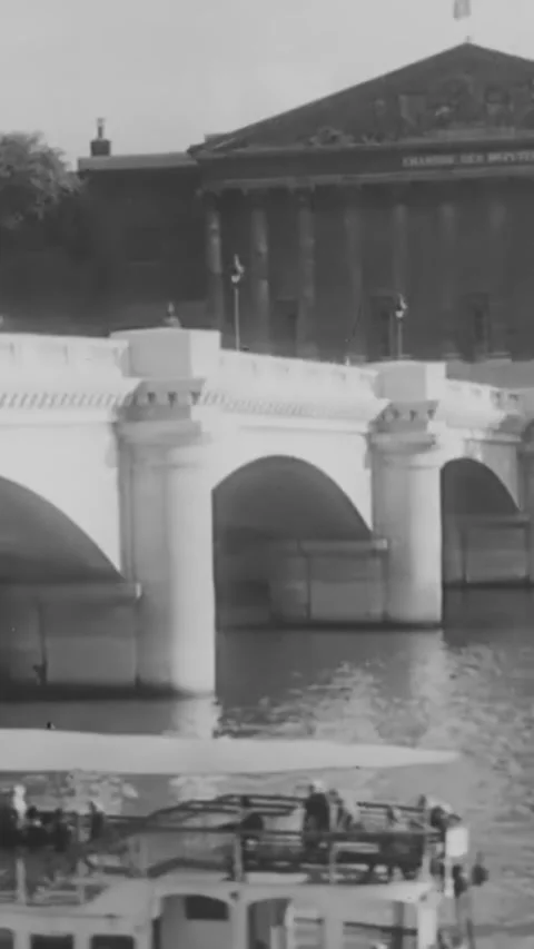 PARIS - 1930s - The sun sets on the Seine, with the Eiffel Tower, Arc de Stock-Footage 342657658