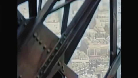 PARIS - 1933 - View tilting down the Eiffel Tower in Paris, France, from inside 스톡 동영상 259550909