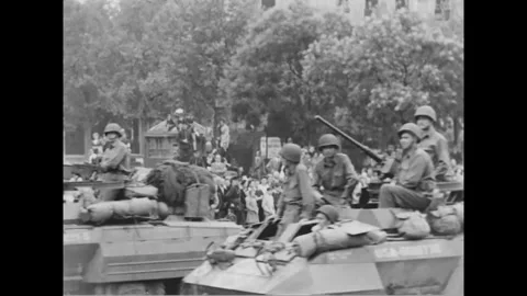PARIS - 1944: Armored column - Armoured cars and jeep move through Paris Stock-Footage 344005771