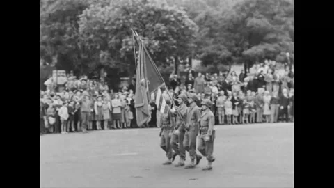 PARIS - 1944: Flag escort - Guard marches past families in liberated Paris Stock-Footage 344005811