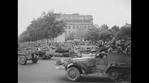 PARIS - 1944: Half-track column - Half-tracks tow guns along a Paris avenue Stock-Footage 344005780