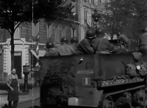 PARIS - 1944: Machine-gun half-tracks — American half-tracks enter Paris Stock-Footage 347864101