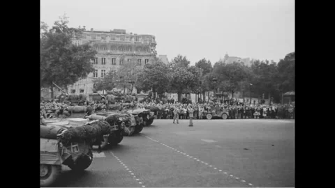 PARIS - 1944: Parade staging area - Kit-laden jeeps stage on a Paris square Stock-Footage 344005750