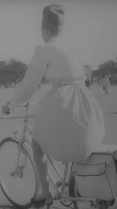 PARIS - 1945 - American soldiers and French civilians bicycle through the Stock-Footage 342663243