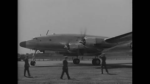 PARIS - 1951 - General Dwight Eisenhower arrives in a Constellation plane at Stock Footage 254073513