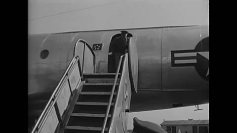PARIS - 1951 - Workers push a ramp to a Constellation plane at Orly Field, Stock Footage 254073274