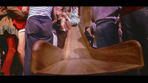 PARIS - 1955 - People dance and go down slides at a costume party in Paris. Video stock 328166332