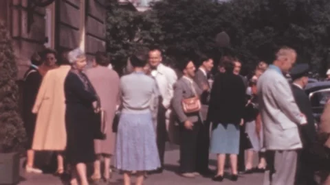 Paris - 1959: groups of elderly caucasian people stand outside by hotel building 스톡 동영상 208113365