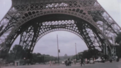 Paris - 1962: driving under the Eiffel Tower Stock Footage 156797859