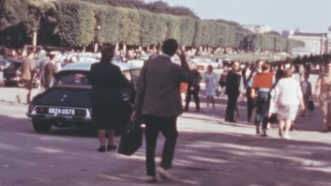 Paris - 1968: Champ de Mars park full of caucasian visitors in sunny day Stock Footage 232307935