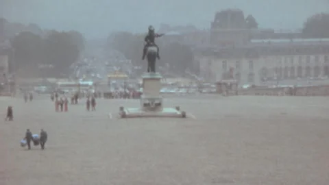 Paris - 1973: tourist sightseeing landmark square by statue of horse rider Stock Footage 231162353