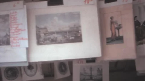 Paris - 1975: Vintage prints and lithographs displayed on an outdoor bookshop Stock Footage 282709341