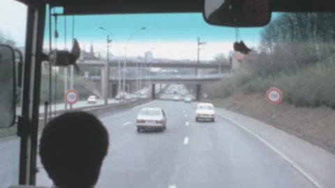 Paris - 1980: bus passengers point of view drive in traffic on city suburbs Stock Footage 221511803