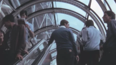 Paris - 1981: People up and down on escalators Stock Footage 246477160