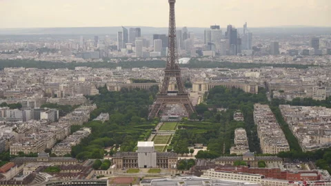 Paris from above showcasing rooftops, the Eiffel Tower, Paris tree-lined avenues Stock Footage 237924969