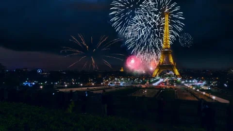 Paris and Eiffel Tower with Fireworks in Night Sky Cinemagraph Stock Footage
