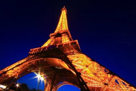 Paris - apr 20: eiffel tower light performance show in dusk with the moonon a Stock Photos