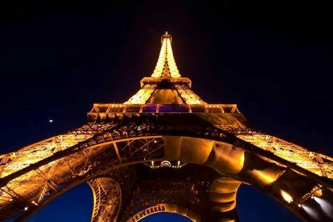 PARIS - APR 20: Eiffel Tower Light Performance Show in Dusk with the Moono... Stock Photos