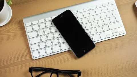 PARIS - April 9, 2017: call. Incoming call to phone on the table in the back of Stock Footage 78144792