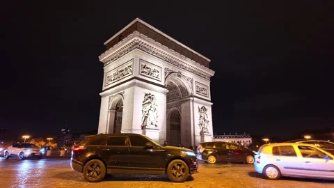 Paris Arc de Triomphe night static shot illuminated monument city traffic France Stock Footage 322088473
