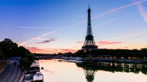 PARIS - AUG 14: Sunrise of Eiffel Tower from Bir Hakeim Bridge and seine rive Stock Footage 66421112