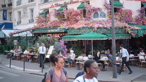 Paris Café Scene, Outdoor Seating with Umbrellas, Bustling Streets, Locals Stock Footage 248422583