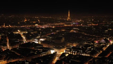 Paris city center by night aerial view lights in streets France Eiffel tower  Stock Footage