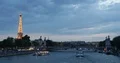 Paris City Skyline with Tour Boat on Seine River and Eiffel Tower Landmark Dusk 4k or 4k+ Resolution