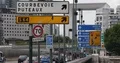 Paris City with Street Sign and Cars Traffic on Busy Road Commuters Commuting 4k or 4k+ Resolution