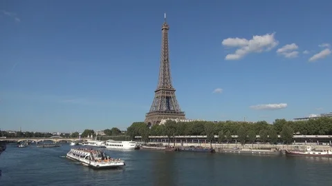Paris Cityscape with Eiffel Tower and Boats Stationed on Seine River Bank Stock Footage 104816248