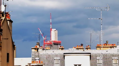 Paris cityscape with roofs, cranes, dramatic skies, antennas, air vents Stock-Footage 63142276