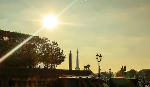 Paris cityscape at sunset with Eiffel Tower and Luxor Obelisk silhouetted, .. Stock-Fotos