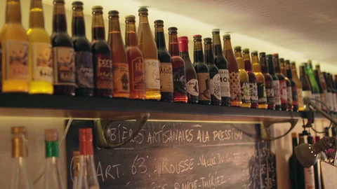 Paris Craft Beer Bottles Rows on Shelf with Blackboard Menu Below Stock Footage 346027237