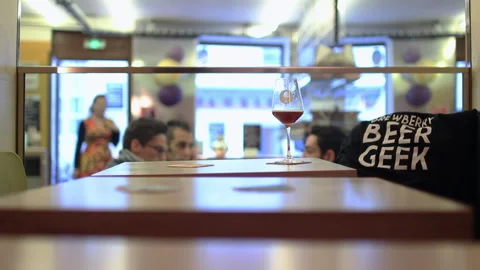 Paris Craft Beer Glass on Seating Area Table with Customers Drinking Stock Footage 346286376