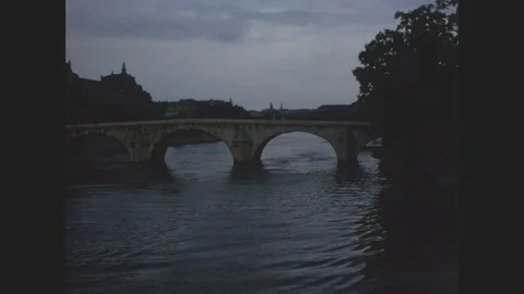 Paris at dawn looking down the Seine River toward the Pont Neuf bridge, 1970 Stock Footage 85825414