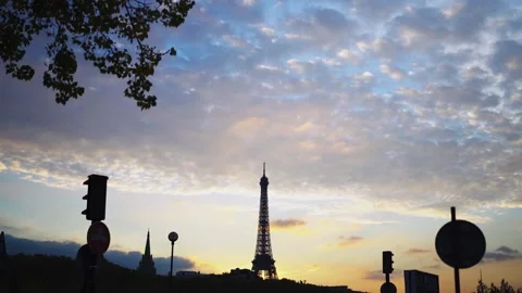Paris Eiffel Tower between street road signs at sunset 1 스톡 동영상 331126105