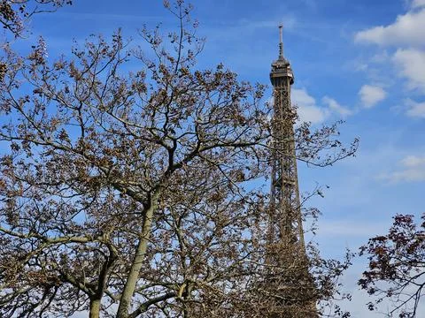 Paris Eiffel Tower, in spring with beautiful sky in the background Stock Photos