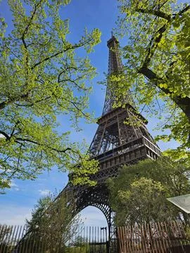 Paris Eiffel Tower, in spring with beautiful sky in the background Stock Photos