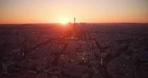Paris Eiffel Tower at Sunset Tilt Up Reveal from Panoramic Rooftop View of Stock Footage 244102928