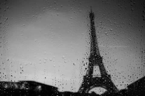 Paris Eiffel Tower through window at rainy weather Stock Photos