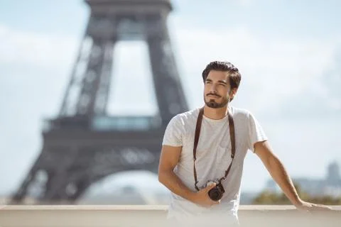 Paris Eiffel Tower tourist with camera taking pictures in front of the Eiffel Fotos de archivo