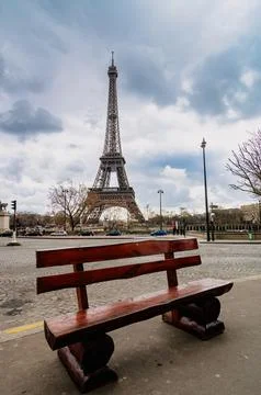 Paris, empty bench with Eiffel tower in the background Stock Photos