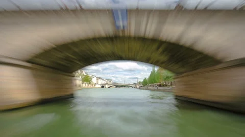 Paris. The excursion motor ship floats down the river Seine in the cloudy spring Stock Footage 48771307