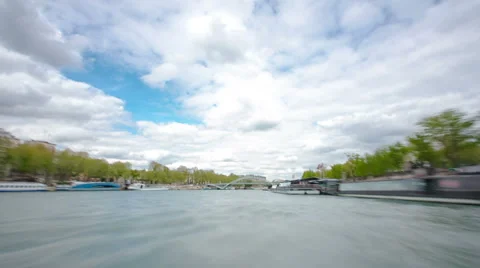 Paris. The excursion motor ship floats down the river Seine in the cloudy spring Stock Footage 48771359