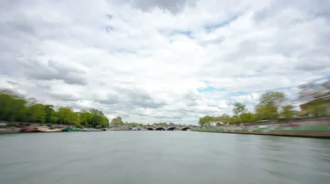 Paris. The excursion motor ship floats down the river Seine in the cloudy spring Stock Footage 48771364