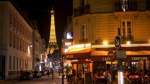 PARIS, FRANCE- CIRCA August 2017: Parisian cafe at night. Famous french landmark Stock Footage