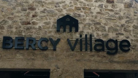 PARIS, FRANCE - SEPTEMBER 1, 2026 - Bercy Village sign on historic stone wall 스톡 동영상 344856440
