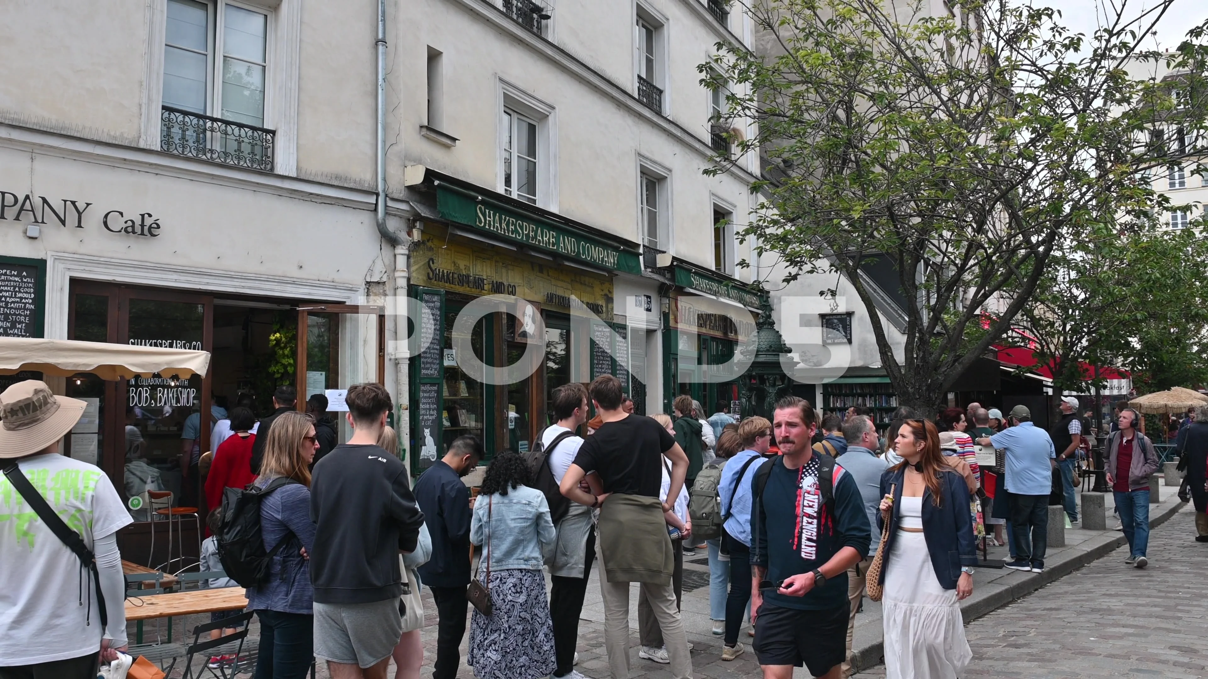 Paris France.Tourist queues outside the Shakespeare and company bookshop.