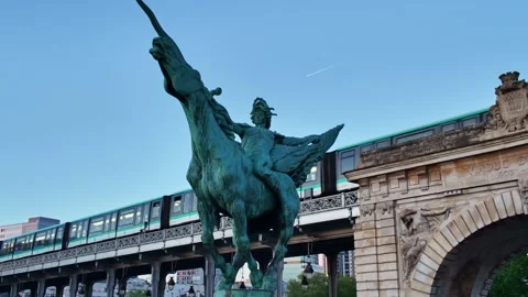 Paris metro train crossing Pont de Bir-Hakeim bridge at sunrise, France Stock Footage 336250768